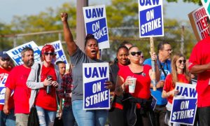 Massive Votes for UAW on Strike against Detroit Three Automakers